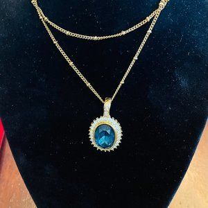 ROMAN SIGNED TOURMALINE CABOCHON IN A YELLOW 14K GOLD PENDANT SURROUNDED BY CZ's